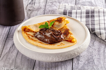 Sweet pancake with chocolate paste