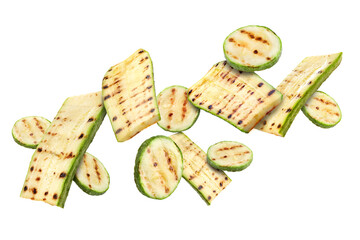 Grilled pieces of zucchini flying in air on white background