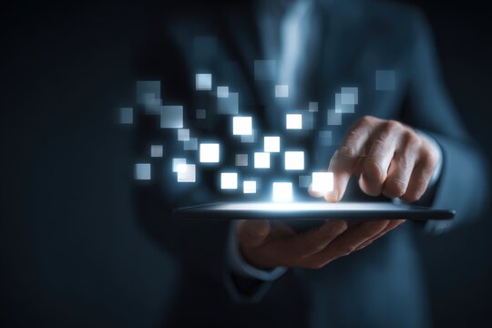 Businessman Using Tablet with Glowing Digital Boxes in Futuristic Office