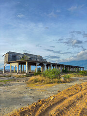 Portrait of the remains of damaged buildings affected by the 2018 tsunami and liquefaction on the coast of Palu City and its surroundings.