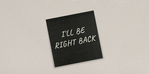 Post it wall background with I ll be right backs message as a note