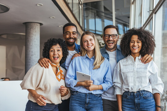  Diverse Group Of Friends In Modern Office, Smiling And Laughing Together For Teamwork And Positive Workplace Culture
