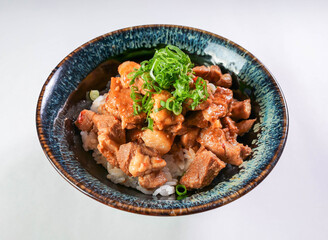 Spicy braised pork belly rice bowl topped with fresh scallions makes for a simple, tasty, and flavorful meal. Perfect for lunch or dinner
