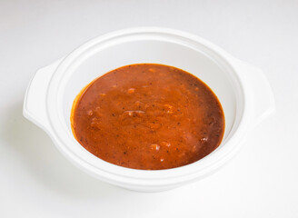 Curry roux chili simmering in a white crockpot. Perfect for a cozy night in or a quick meal prep solution. Warm, hearty, and full of flavor.