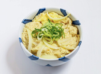 Egg bowl Japanese cuisine with this comforting oyakodon rice bowl, featuring tender chicken and egg in a flavorful sauce.