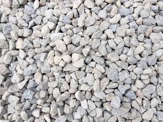White grey small rocks texture background.