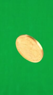 A single gold coin spinning in the air against a solid green background creating a simple but elegant effect