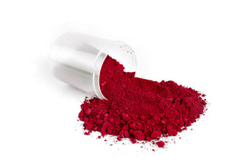 Bright Red Powder Spills From a Container on a White Surface Creating a Vibrant Display