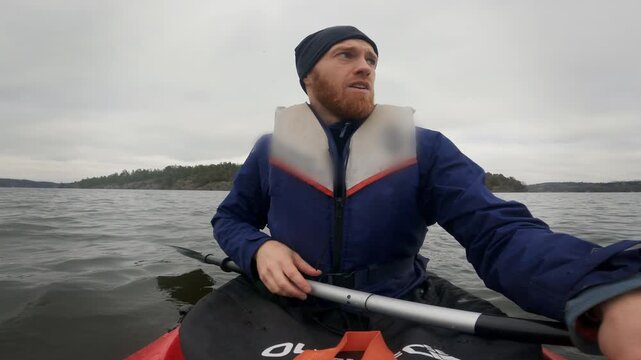 Kayaker Navigating with Compass