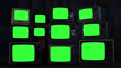 Retro television sets stacked in dim light create vintage technology vibe perfect for nostalgia or historical content, moody and atmospheric video