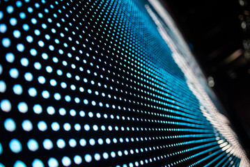 Abstract blue luminous dotted wave structure forming dynamic technological motion backdrop with futuristic geometric curvature perfect for innovation. Led Screen on stage