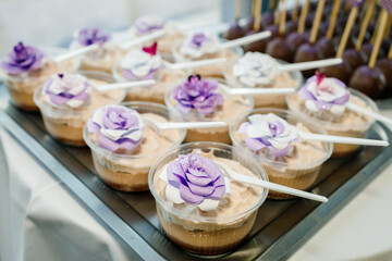 Delicious floral dessert cups displayed at an elegant event