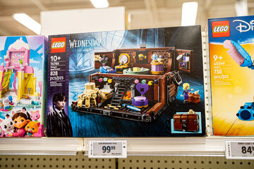 Naklejka premium Close up of Lego Wednesday Thing's Apartment building set on store shelf. Brampton, Canada - November 16, 2025.