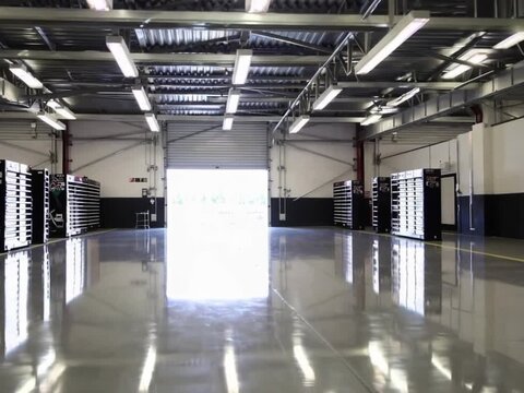 Clean Empty Racing Garage Interior with Open Door, Ultra HD
