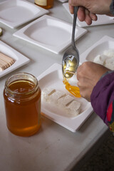 Traditional table  fresh ricotta with honey cheese artisanal requesón, mató, mel, miel