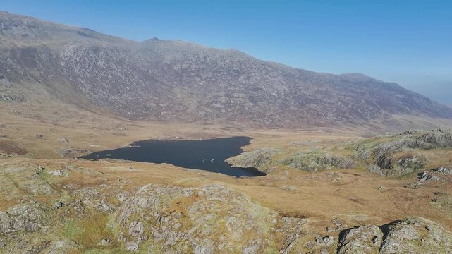 Autumn colours over Llyn Cwmffynnon and Miner&rsquo;s Track - Start Point, road A4086 from a drone, Pen-y-Pass, Snowdonia, Wales, UK