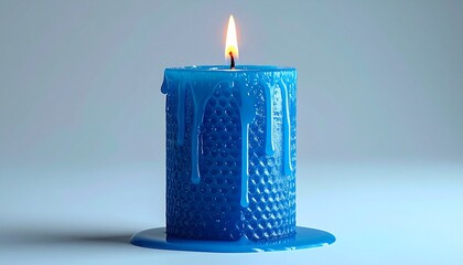 Lit blue candle with dripping wax on gradient blue background