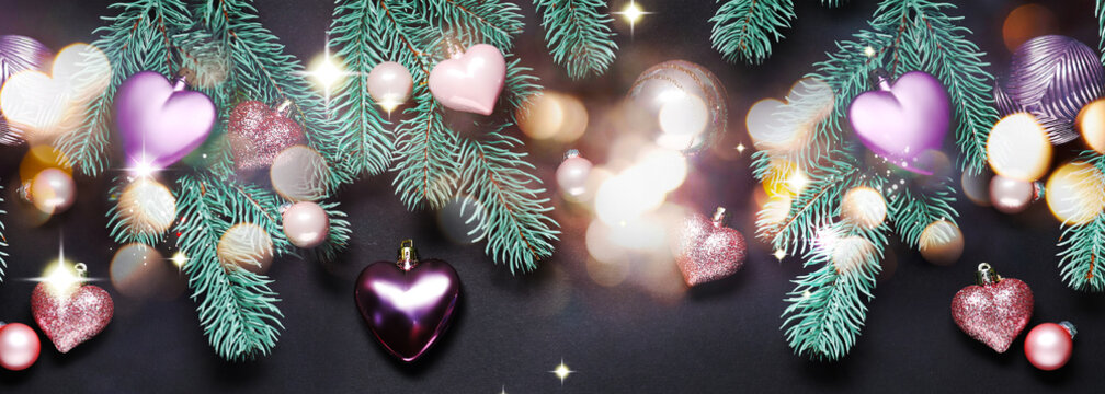 Merry Christmas and Happy Holidays. Greeting card with festive ornaments, fir tree branches and bokeh lights on black background - Powered by Adobe