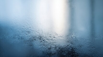 Raindrops on a window during a chilly morning