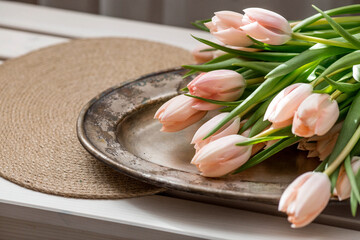 The concept is timed to the arrival of spring and International Women's Day on March 8. A bouquet of spring, delicate tulips in close-up.