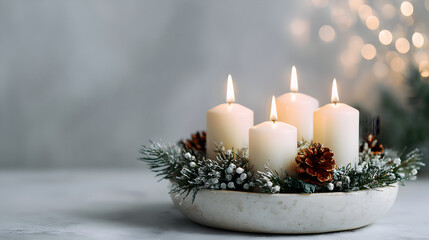 Advent wreath with four lit candles surrounded by pine branches and decorative elements, symbolizing the festive spirit of the Christmas season and Catholic traditions