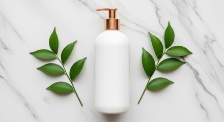 Elegant white dispenser bottle with rose gold pump surrounded by fresh green leaves on a marble surface