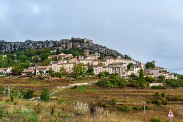 Cluster of houses forming the medieval village of Trigance with its castle on a rocky cliff in Provence, France