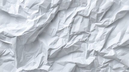 Obraz premium Light plays across the surface of wrinkled white paper revealing intricate textures and patterns.