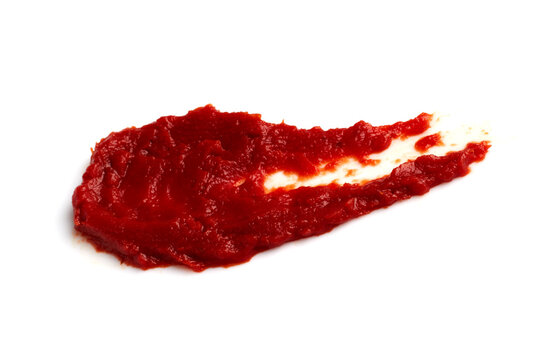 A drop of smeared red tomato paste isolated on a white background.