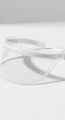 Clear safety glasses on a white background, minimalist and clean studio shot.