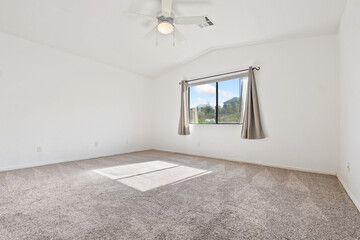 Obraz premium A Spacious and Modern Bedroom, Filled with Natural Light and Comfort