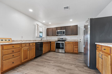 Modern Kitchen with Stainless Steel Appliances and Wood Cabinets