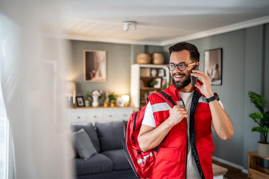 Paramedic man talking on phone wearing uniform
