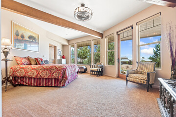 In the center of the room, there is a large bed positioned perfectly