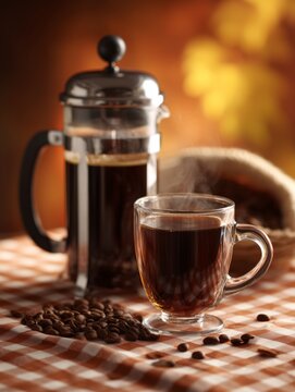 A cup of coffee and beans, French press with bokeh on background, warm and cozy
