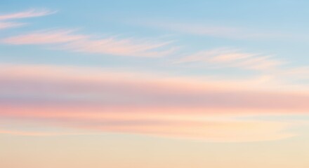 A tranquil landscape at sunset, featuring a serene sky with pastel-colored clouds and a warm, glowing horizon. The scene evokes a sense of peace and calm.