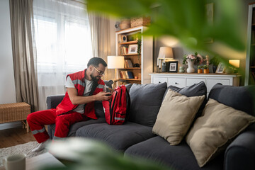 Obraz premium Paramedic man relaxing at home after work shift