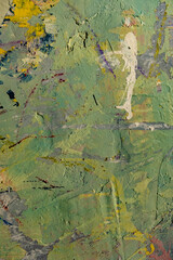 a textured, weathered wall with a chaotic mix of colors and textures.  The surface is heavily textured, showing signs of age and wear, with visible cracks and layers of paint