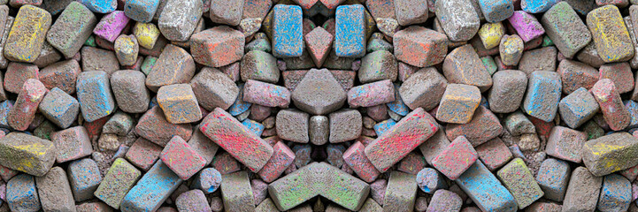 Colored pieces of chalk. Broken pieces of colored dirty chalk