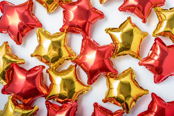 Colorful star-shaped balloons create a festive atmosphere for celebrations and events in bright red and gold tones