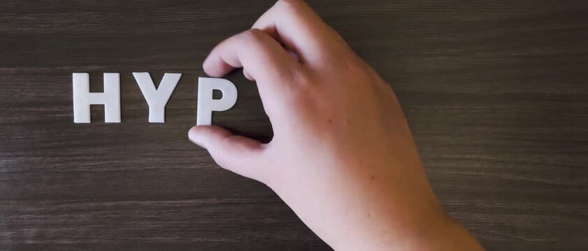 the word hypotension written on a dark background with white block letters or  capital letters