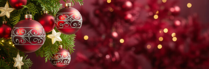 Festive Christmas tree decorated with red ornaments and gold stars creating a warm inviting holiday atmosphere perfect for seasonal greetings and celebrations