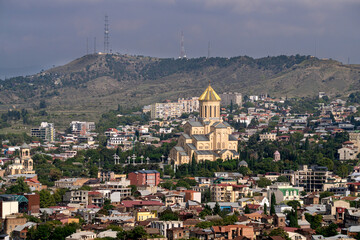 Tbilisi landmarks. A temple on a mountainside between houses. Traveling around Georgia. View of Tbilisi in autumn in October. Cityscape in Georgia.