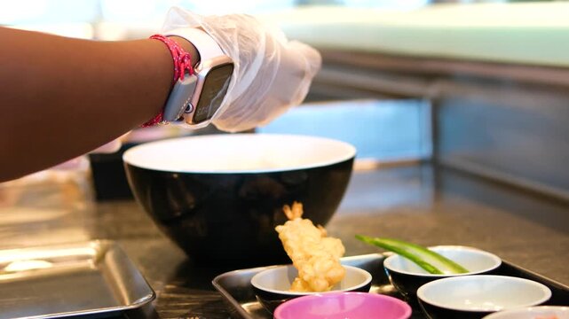 sushi preparation process Sushi chef, preparation and hands roll fish in restaurant. Kitchen, culinary artist and gourmet tuna ingredients for seafood snack, nutrition and meal