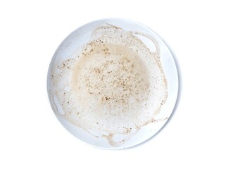 Dirty white plate with left over food isolated on white background, Top view	