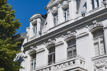 Ornate historic white building facade with decorative window details