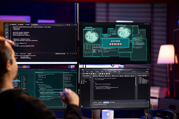 Cybercriminal getting access denied message when trying to infiltrate malware past security. Hacker failing to make script able to hide malicious code from detection systems, getting attack rejected