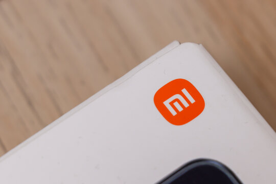 Warsaw, Poland - November 20, 2025: Close-up shot of Xiaomi logo on a product packaging, showcasing the brand identity and modern design elements.