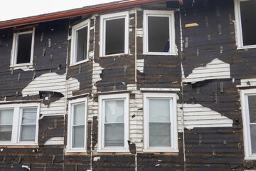 Large old house in the process of renovation with portions of it's siting removed