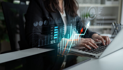 A businesswoman conducts financial analysis using a laptop, visualizing data with graphs and statistics in a contemporary office setting, emphasizing growth and success. Scalp